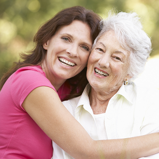 A happy resident of St Nectans Residential Care Home with their family